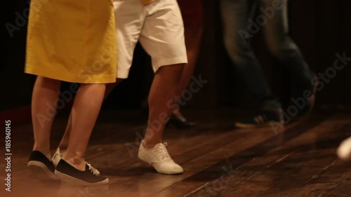 A couple Latin Dancing at the busy Salsa Club. Slow motion, variable frame rate shots photo