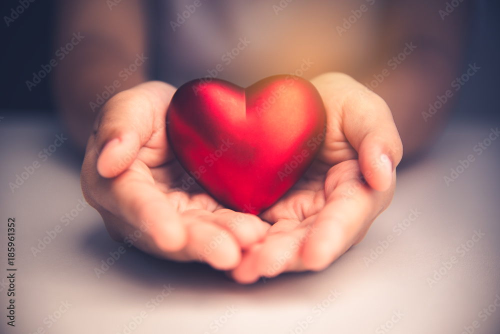 Hand give red heart for love