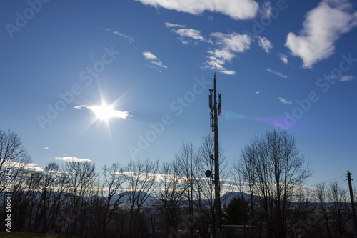 cellphone radiomast on december sunny blue sky photo