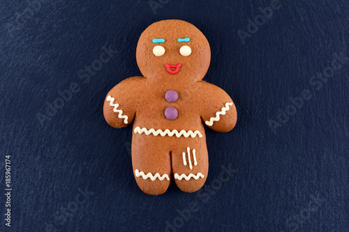 Gingerbread Man on dark background. Christmas or New Year composition. Christmas card.