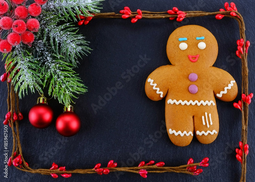 Gingerbread Man lying on dark background. Christmas or New Year composition. Christmas card.
