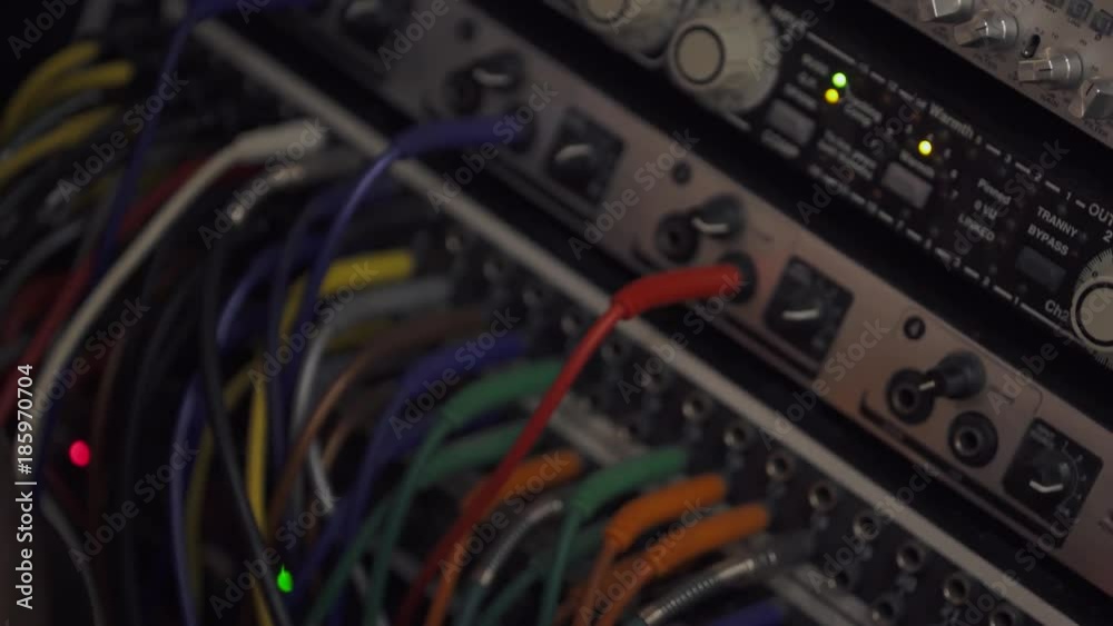 Recording studio, the wires connected to music splitter console, close-up.
Recording studio, the wires connected to music splitter console, close-up.