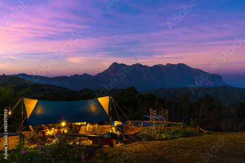 Beautiful Sunset at campsite with Doi Luang Chiang Dao Mountain in Chiang Mai province Thailand. It is a second highest mountain in Northern Thailand © pomphotothailand