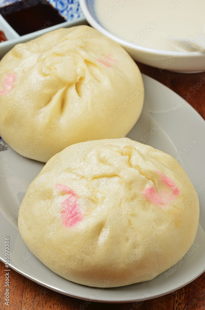 Steamed stuffed buns on a plate