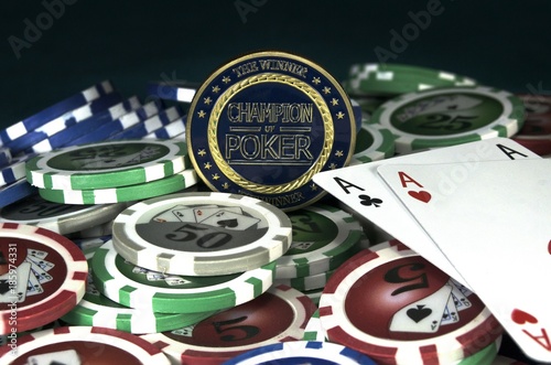 Poker chips and card with gold Champion of Poker coin