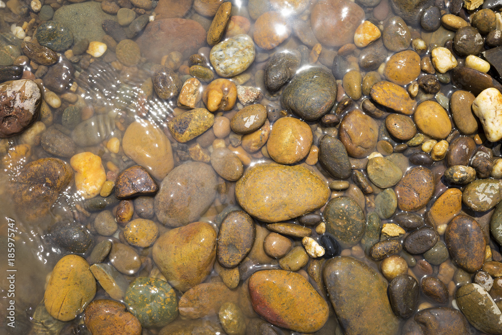 Closeup Natural colore river stone from the stone beach on Maekhong river north of Thailand, outdoor day light Closeup Natural colore river stone from the stone beach on Maekhong river north of Thailand, outdoor day light