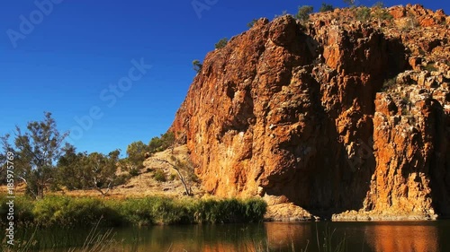 panning shot of glen helen gorge in the west macdonnell ranges near alice springs photo