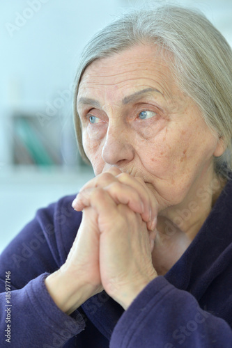 beautiful sad elderly woman close-up