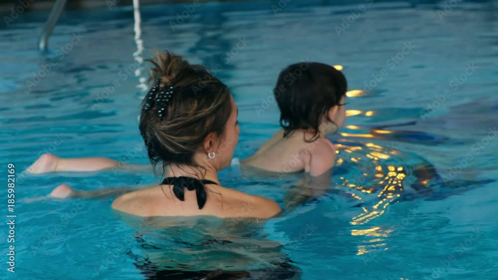 baby child learn float pool mom teach swim familiar water baby child learn float pool mom teach swim familiar water
