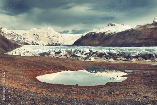 Svinafellsjokull breathtaking outlet glacier, Vatnajokull National Park, Iceland Mountain landscape. VIntage filter applied. photo