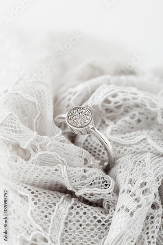 Wedding or engagement silver ring on lace