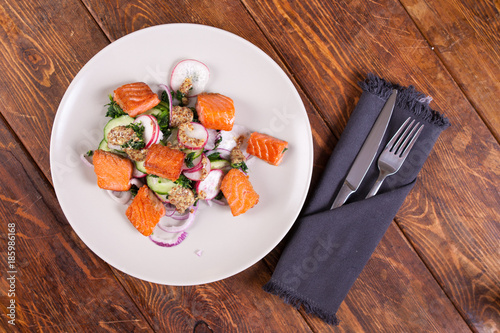 Salad with grilled salmon and  radish 