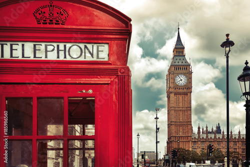 London - Big Ben tower and a red phone booth. Vintage filter applied.
