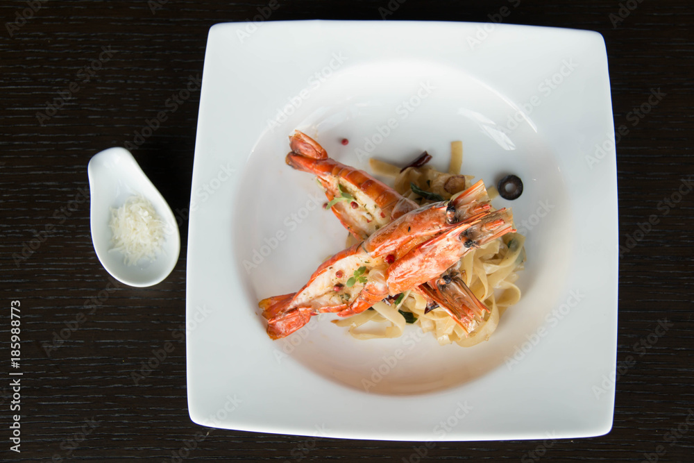 plate of spicy spaghetti with shrimps. plate of spicy spaghetti with shrimps.