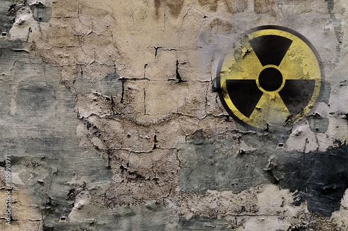 Sign of nuclear danger on a wall photo