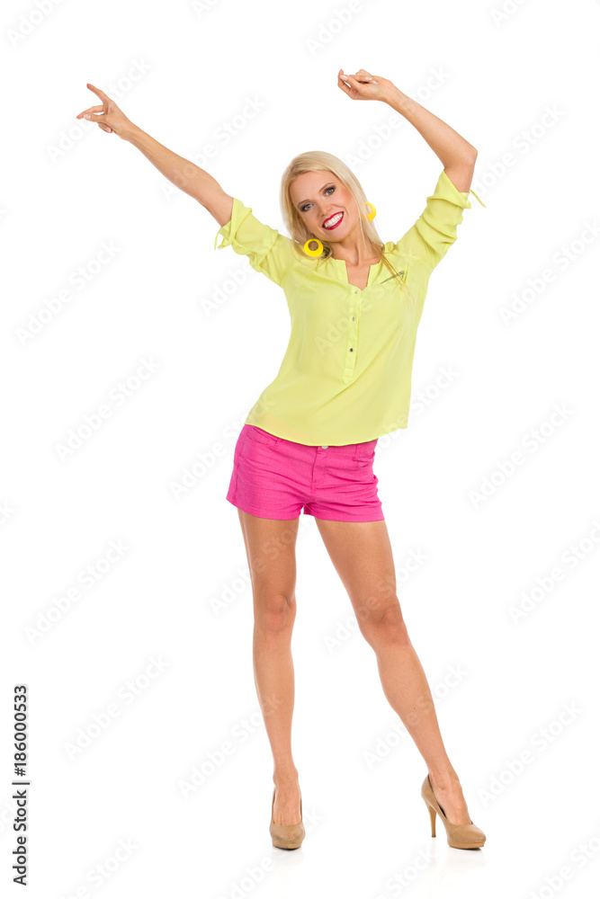 Blond Woman In High Heels Is Standing And Waving Hands Blond Woman In High Heels Is Standing And Waving Hands