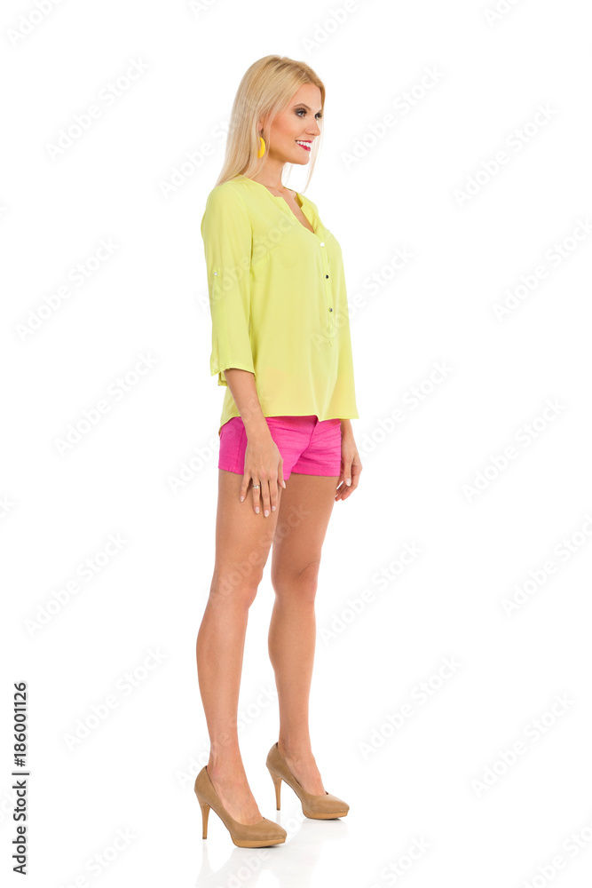 Beautiful Woman In High Heels Is Standing At Attention. Side View. Stock Photo Adobe Stock
