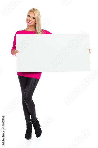 Smiling Beautiful Woman Is Posing With White Placard