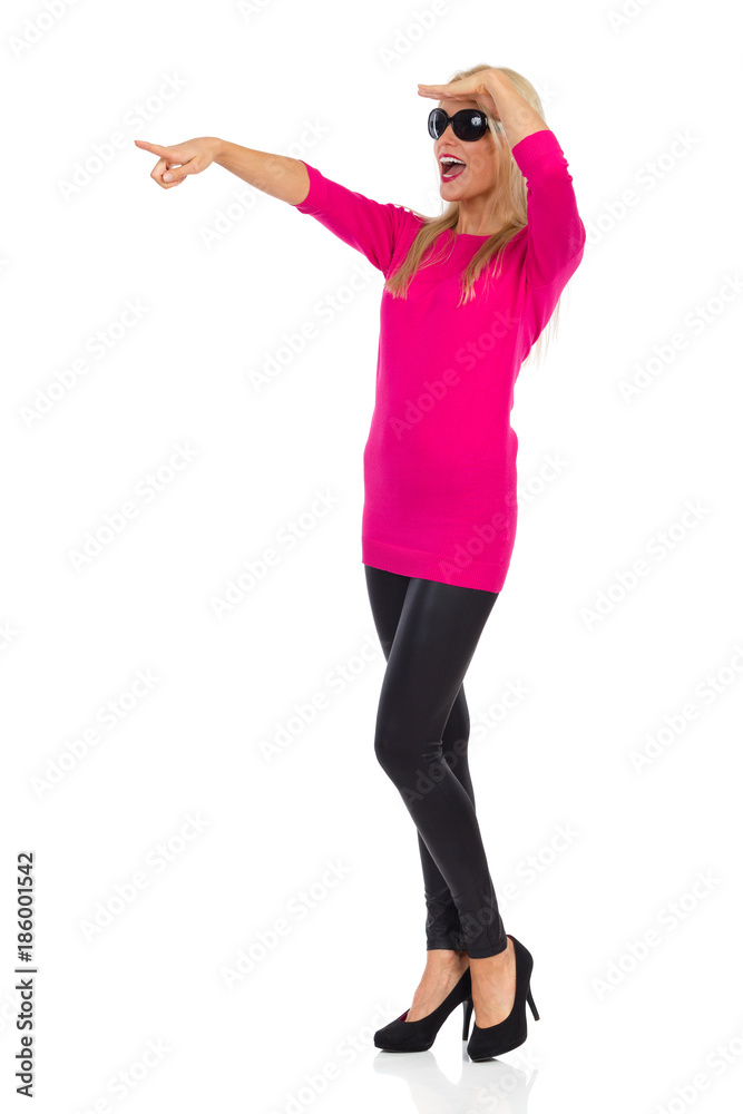 Happy And Confident Woman Is Looking Away, Pointing And Shouting