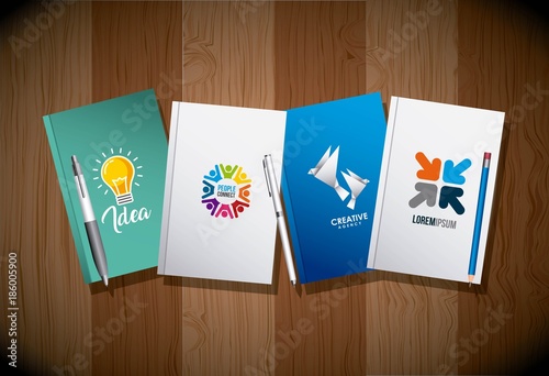 four diary and pens corporate identity template advertising business wooden background