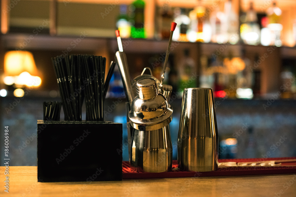 Shakers and tubes for cocktail on the bar