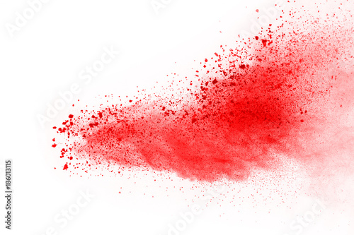 abstract powder splatted background. Red powder explosion on black background. Colored cloud. Colorful dust explode. Paint Holi.