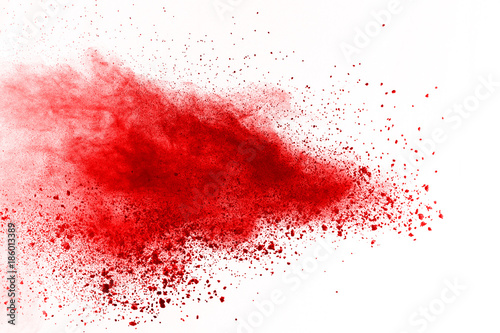 abstract powder splatted background. Red powder explosion on black background. Colored cloud. Colorful dust explode. Paint Holi.