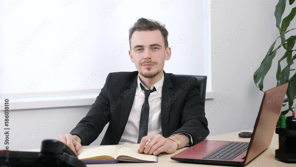 Young businessman in suit showing hello sign and and waving his hand 60 fps Young businessman in suit showing hello sign and and waving his hand 60 fps