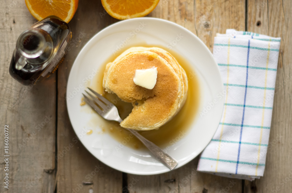 Small homemade pancakes on the wooden table, top view Small homemade pancakes on the wooden table, top view
