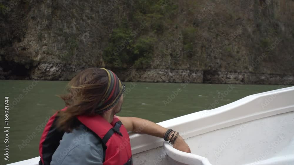 driving on boat, passenger in life vest sitting in riding boat, tour in the Sumidero Canyon - Chiapas, Mexico
driving on boat, passenger in life vest sitting in riding boat, tour in the Sumidero Canyon - Chiapas, Mexico