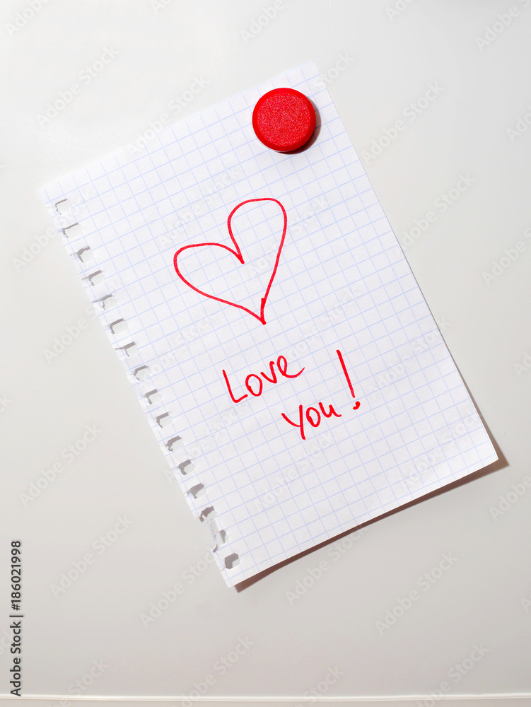 love you note on fridge door hold by red magnet love you note on fridge door hold by red magnet