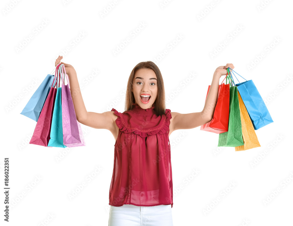 Excited young woman with shopping bags on white background Excited young woman with shopping bags on white background