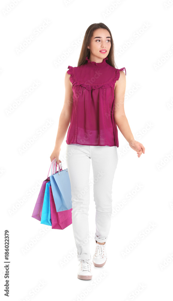 Beautiful young woman with shopping bags on white background Beautiful young woman with shopping bags on white background