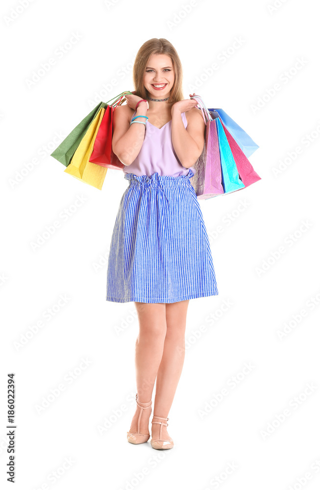 Happy young woman with shopping bags on white background Happy young woman with shopping bags on white background