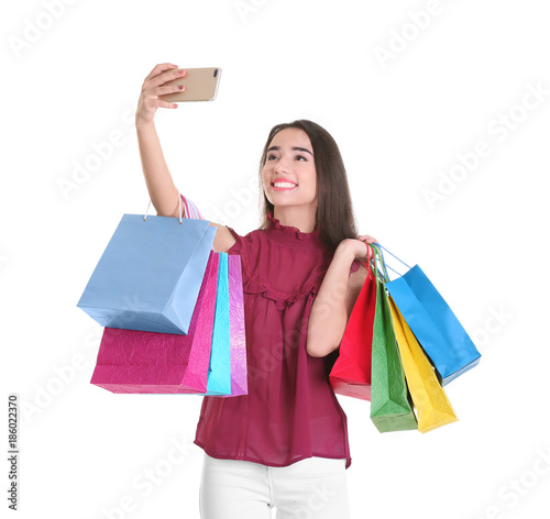 Happy young woman with shop...