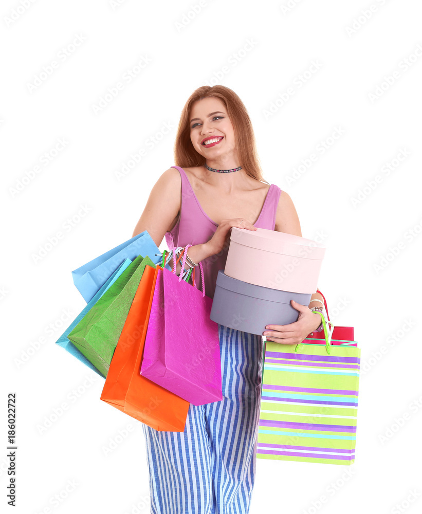 Happy young woman with shopping bags and boxes on white background Happy young woman with shopping bags and boxes on white background