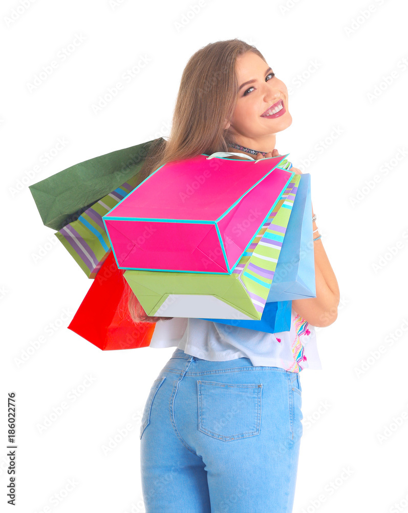 Happy young woman with shopping bags on white background Happy young woman with shopping bags on white background