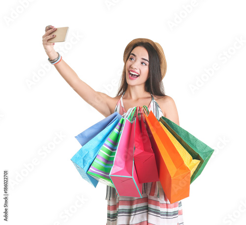 Happy young woman with shop...
