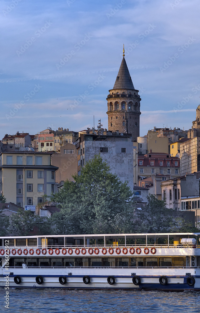 Fototapeta premium Cityscape summer sea front view with Galata Tower and Gulf of the Golden Horn in Istanbul, Turkey.