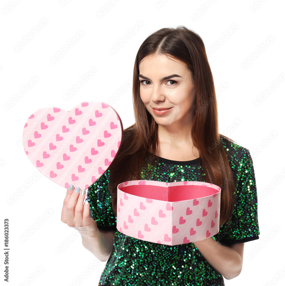 Beautiful young woman opening box with gift for Valentine's Day on white background Beautiful young woman opening box with gift for Valentine's Day on white background
