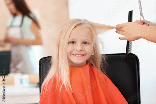 Female hairdresser working ...