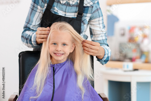 Female hairdresser working ...
