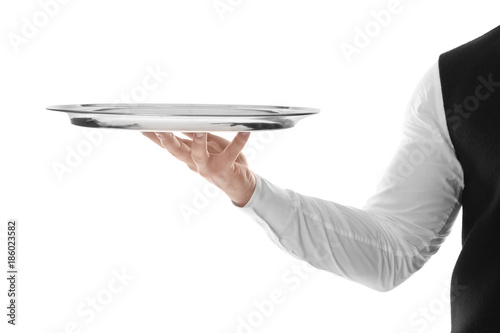 Waiter with empty tray on white background photo
