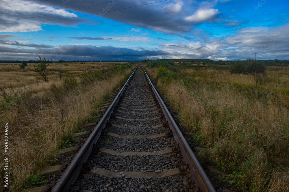 Railway track on the sky background