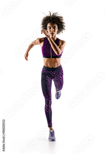 Young african girl runner in silhouette on white background. Dynamic movement. Sport and healthy lifestyle.