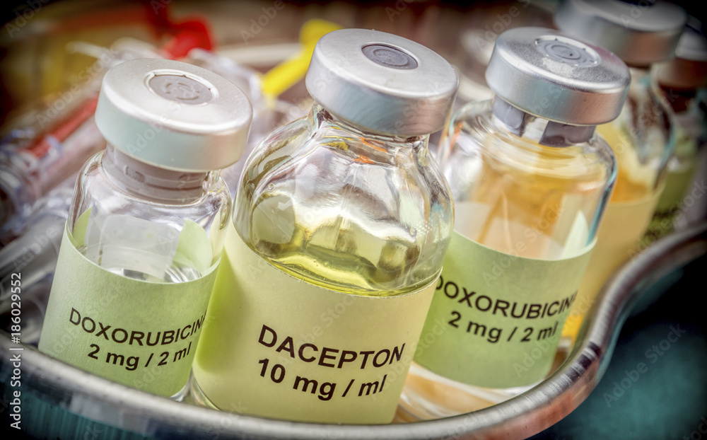 Vials of different size with medication used for neurodegenerative diseases, conceptual image Vials of different size with medication used for neurodegenerative diseases, conceptual image