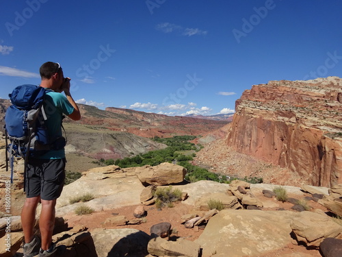 Male Hiker taking photo in desert scenery © area51uk
