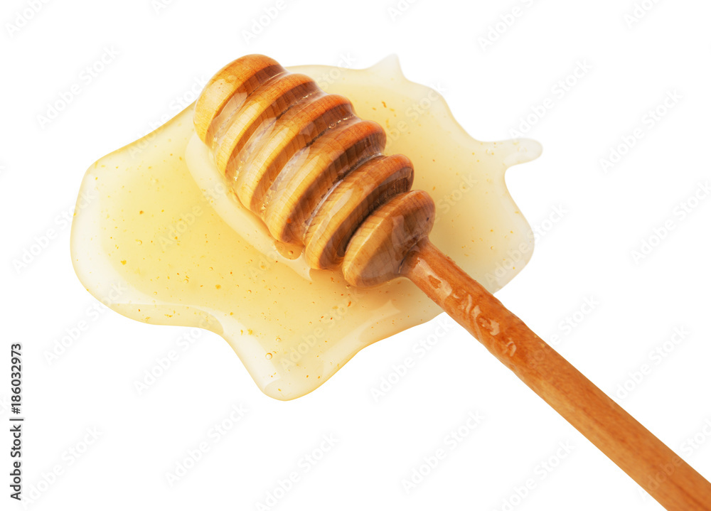 Fresh honey and wooden dipper Fresh honey and wooden dipper