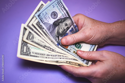 Close Up Male Hands Count Dollar Bills. Lack of money