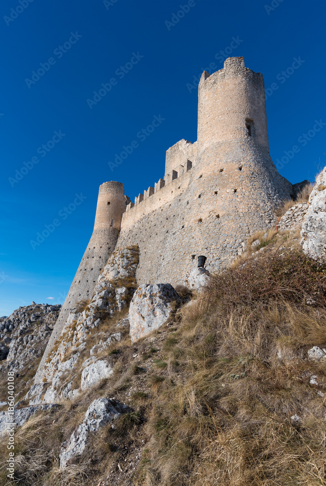 Rocca Calascio (Italy) - The ruins of an old medieval village with castle and church, over 1400 meters above sea level, on the Apennine mountains, in the heart of Abruzzo.